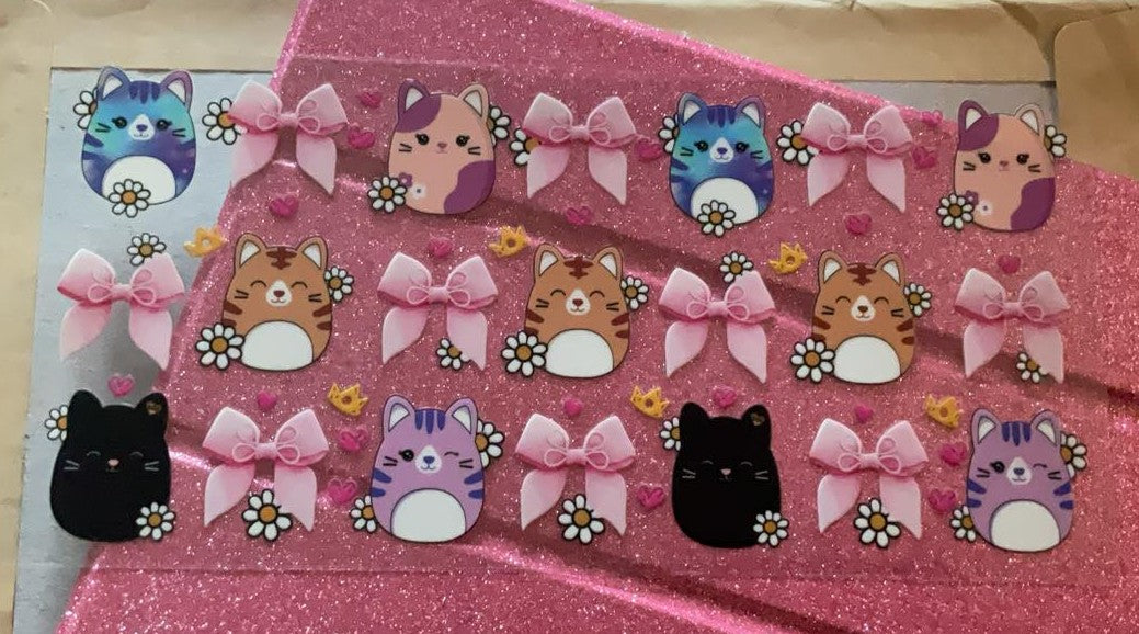 squishmallow cats and bows